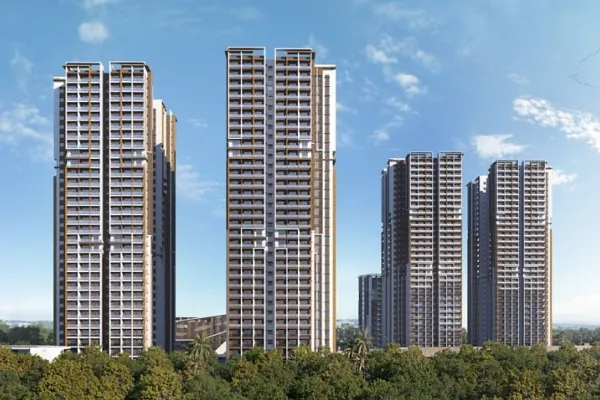 Five towers of DSR The Address rising above trees in daylight